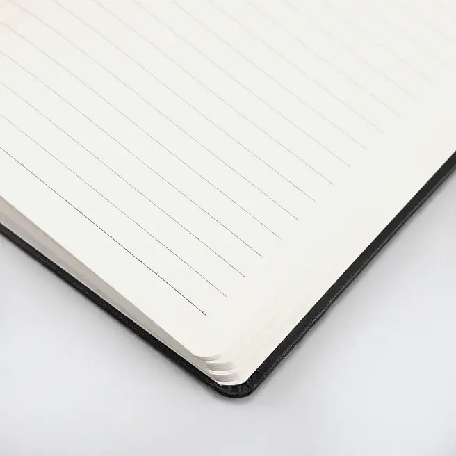 Inside ruled pages of personalized black hard cover notebook designed for smooth writing and note taking.